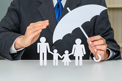 Businessman uses hands and an umbrella to protect family members Whole Life Insurance - Death Benefit Coverage - AdvInsCon.com